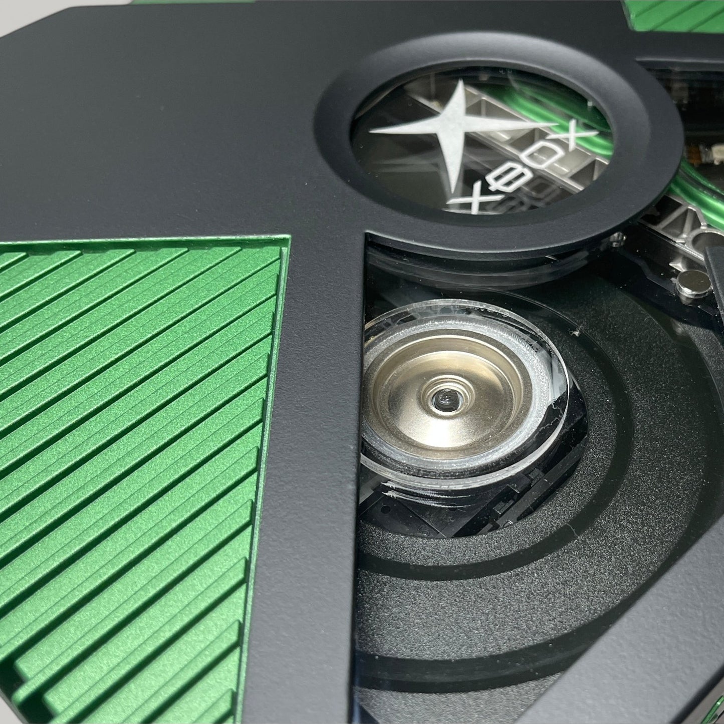 StudioFR custom black and green Xbox Original console with window mod showing internal components and RGB lighting.