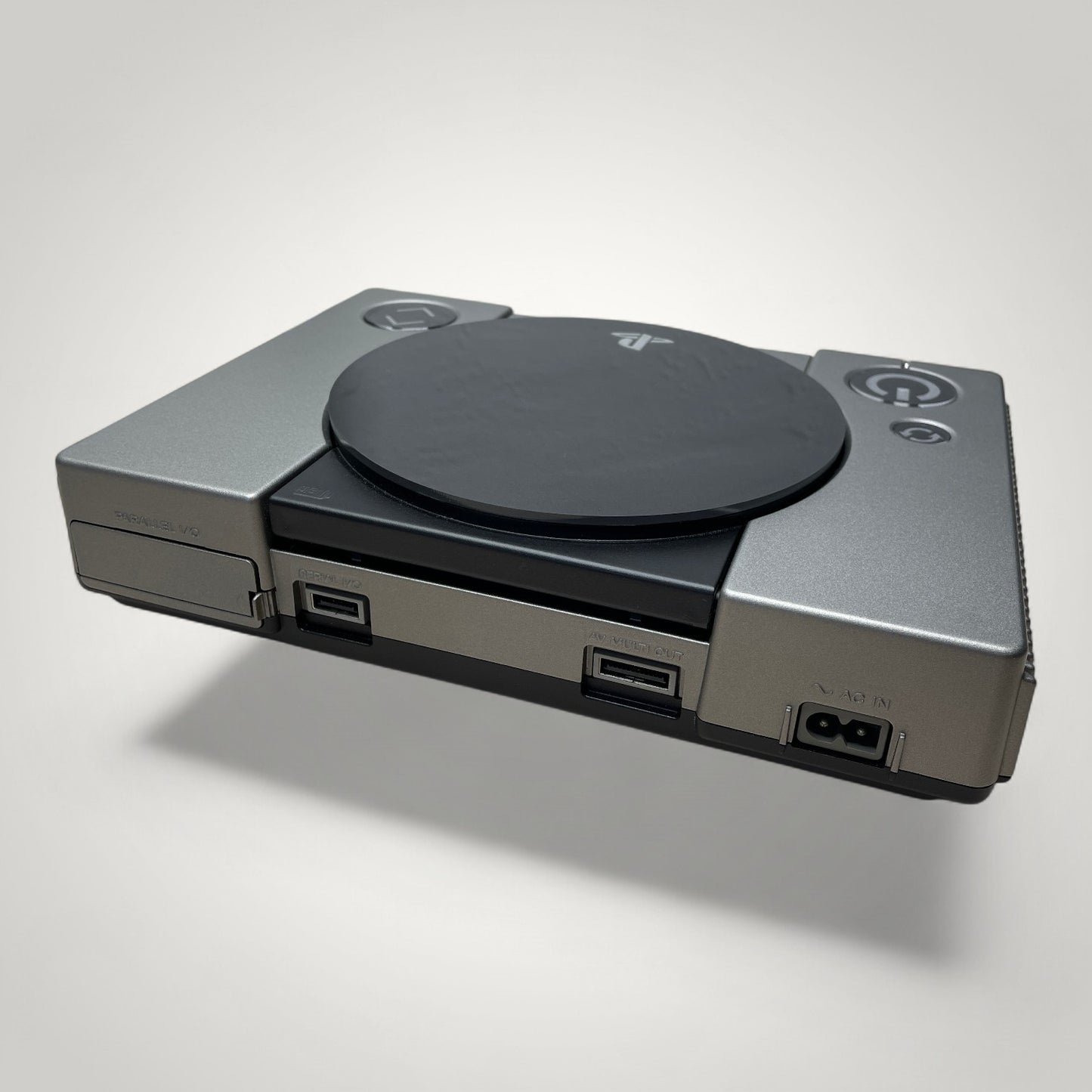 StudioFR customized black and grey PlayStation 1 console with engraved logo and buttons, and RGB lighting.