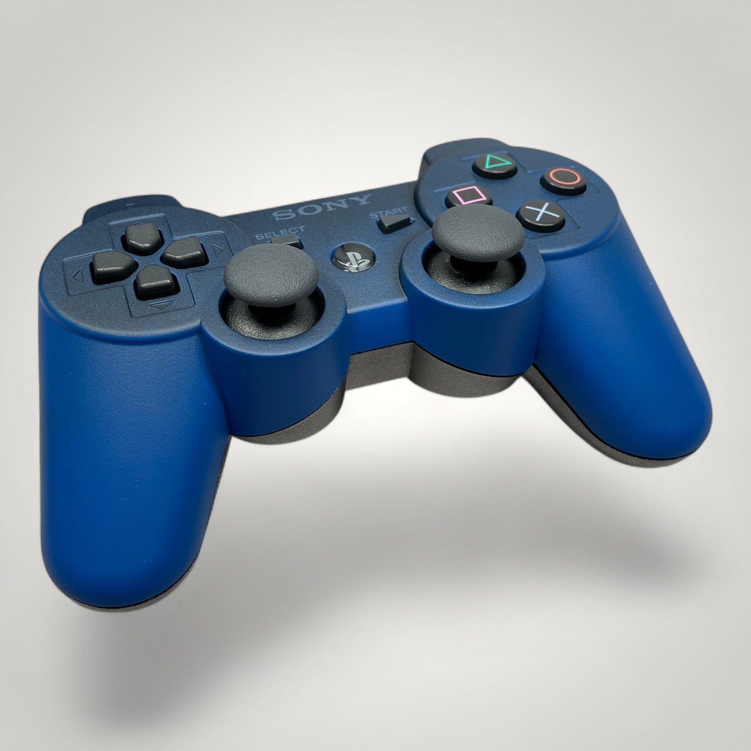 StudioFR custom blue and steel PS3 controller with grey analog sticks and buttons.
