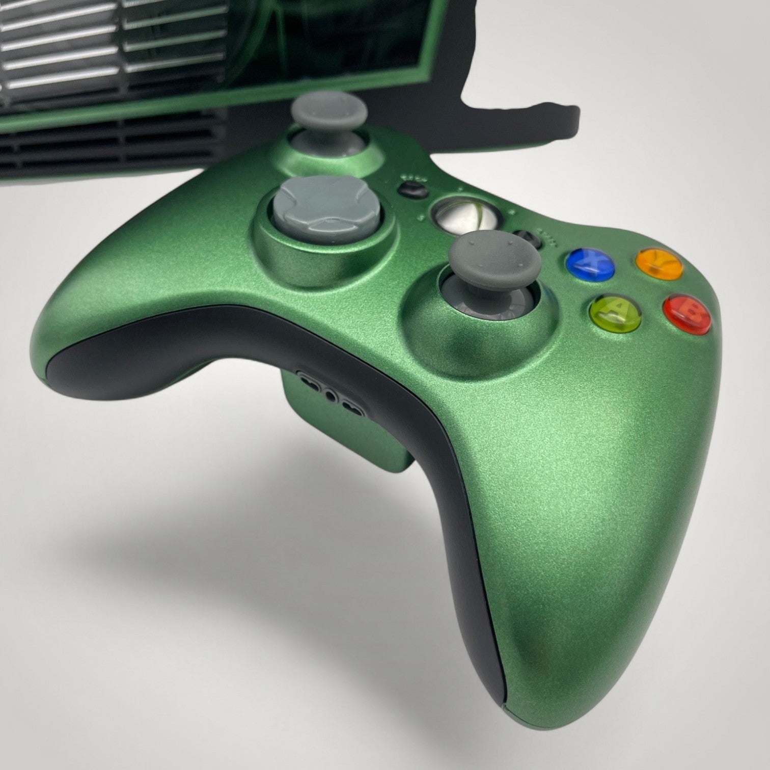 StudioFR custom black and green Xbox 360 Slim controller with grey joysticks and buttons.
