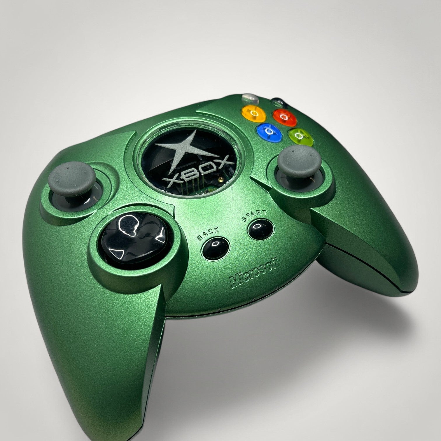 StudioFR custom green Xbox Original controller with black buttons and grey joysticks. Features RGB lighting.