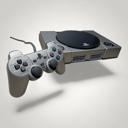 StudioFR custom black and grey PlayStation 1 console with matching controller. Features engraved logo and buttons.