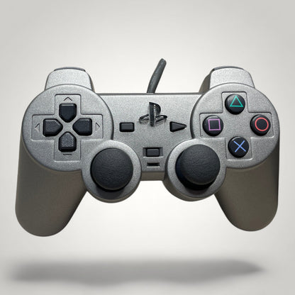 StudioFR custom black and grey PlayStation 1 controller with engraved buttons and logo.