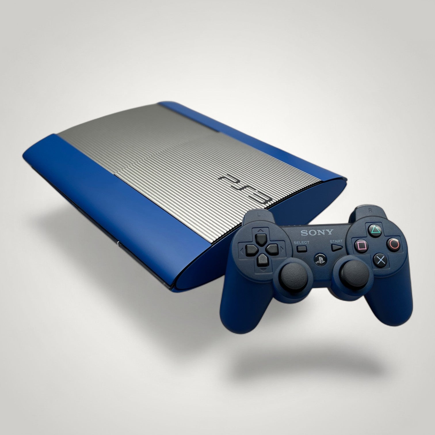 StudioFR custom steel and blue PS3 Super Slim console with matching controller.