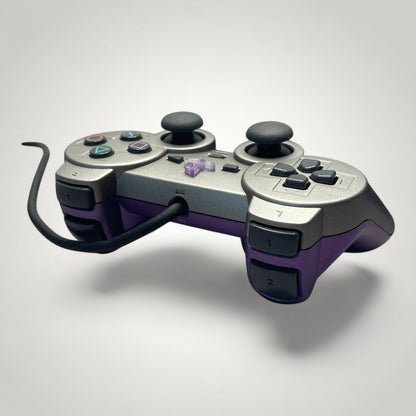 StudioFR custom purple and grey PlayStation 2 controller with black buttons and analog sticks.