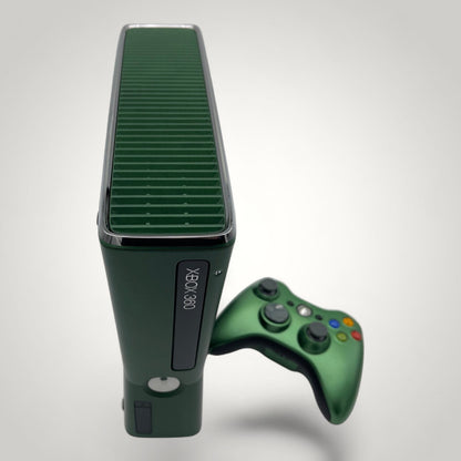 StudioFR custom black and green Xbox 360 Slim console with matching controller. Features a window mod with engraved logo and RGB lighting.