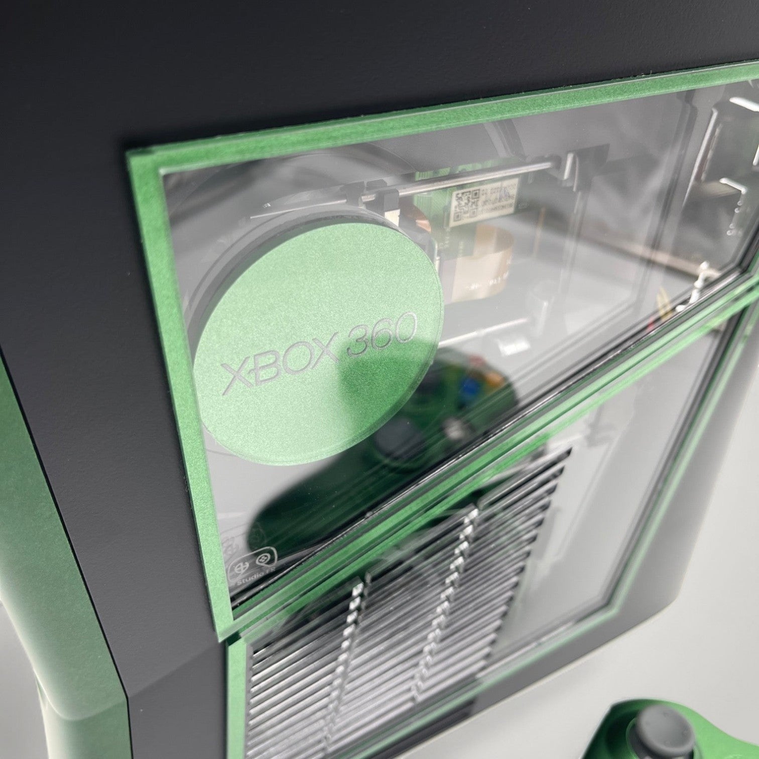 StudioFR custom black and green Xbox 360 Slim console with window mod and RGB lighting, includes matching controller.