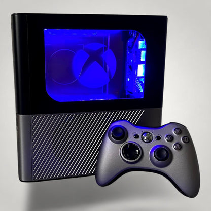 StudioFR custom black and grey Xbox 360E console with RGB lighting and matching controller.