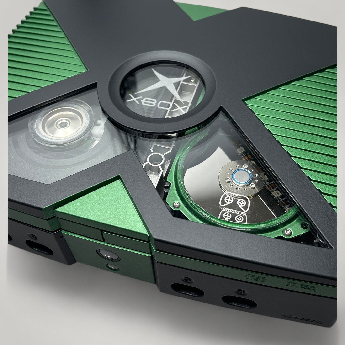 StudioFR custom black and green Xbox Original console with window mod, RGB lighting, and upgraded HDD.