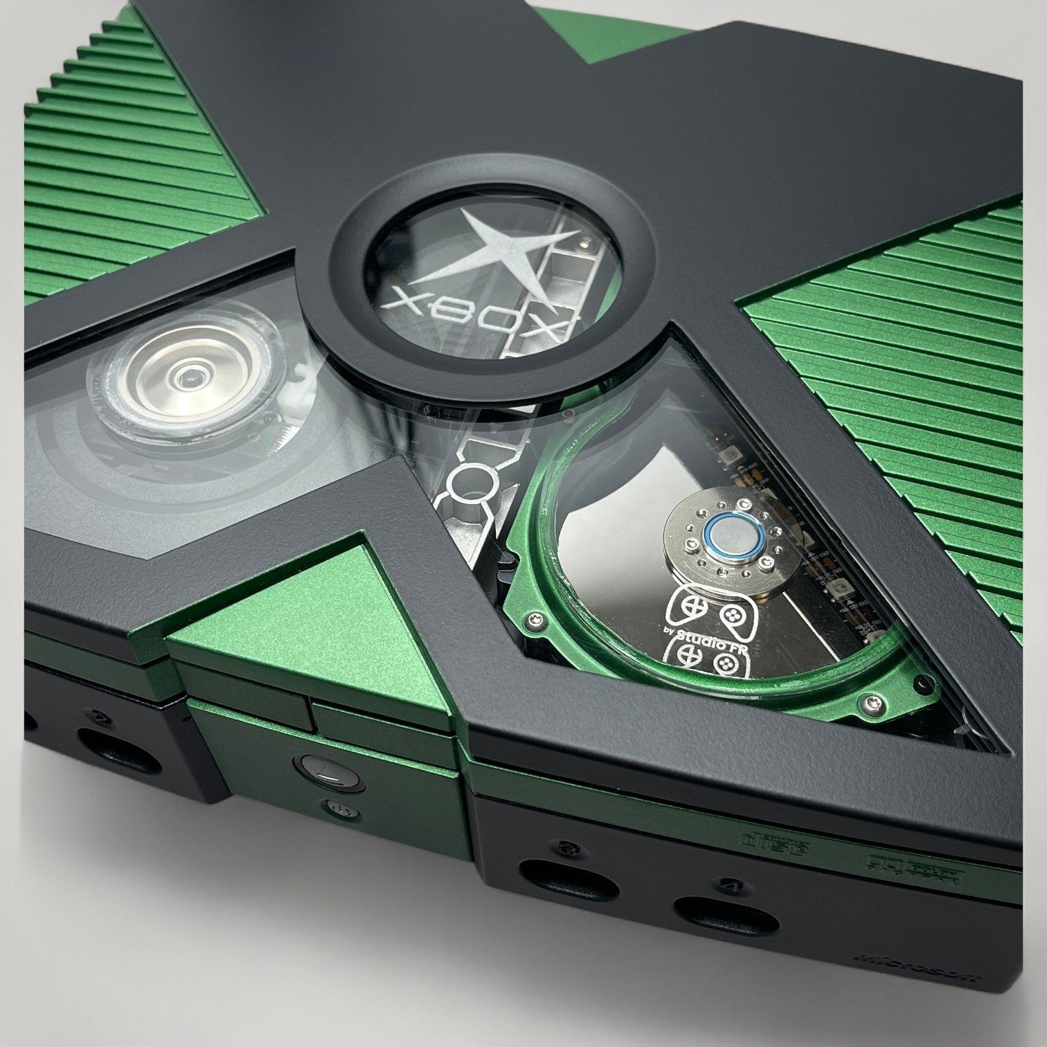 StudioFR custom black and green Xbox Original console with window mod, RGB lighting, and upgraded HDD.